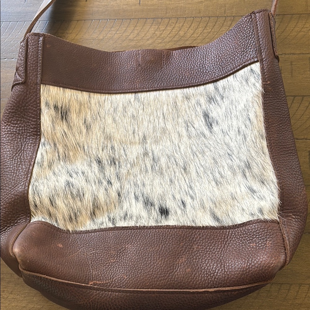Fringe Hill custom leather bag. Natural distressed leather and cow hide.